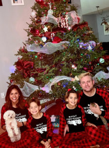 Eric graham and family in front of christmas tree
